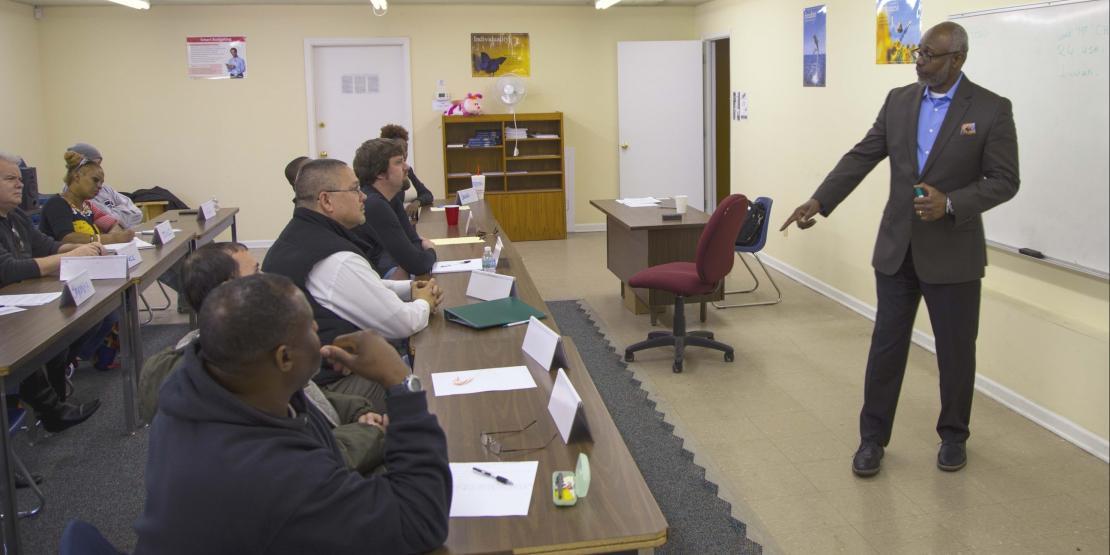 ​​​​​​​Instructor Junie Christian leads a Job Readiness Boot Camp class at Religious Community Services  in New Bern.
