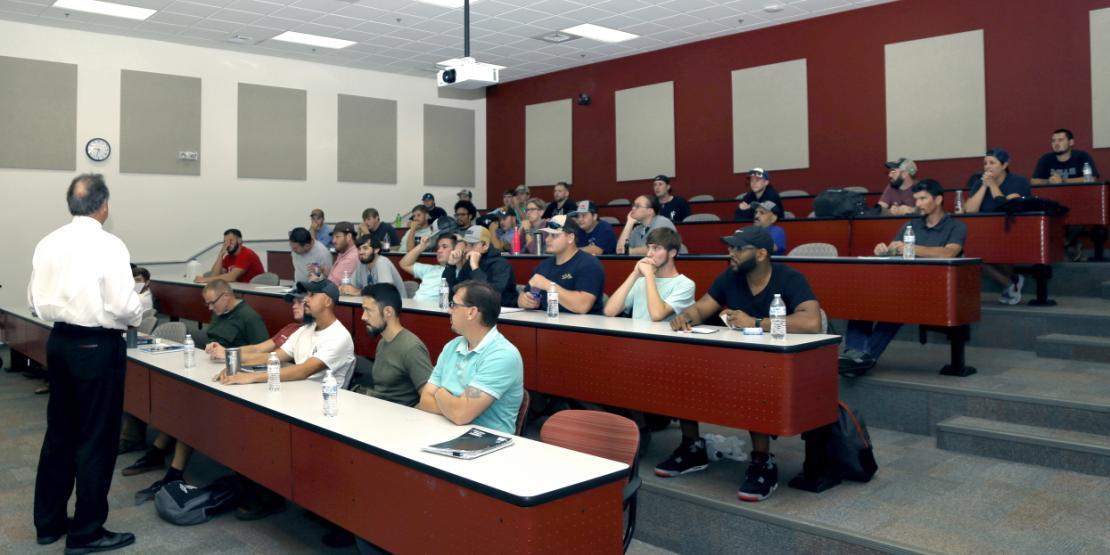 Students in the new Fleet Readiness Center East apprenticeship program are welcomed by Ricky Meadows, Craven CC dean of career programs, during week one of instruction. The first year of the program involves academic instruction through Craven CC, followed by hands-on training at FRC East facilities.