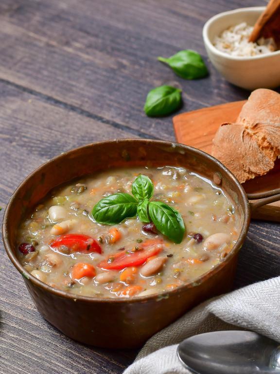 Traditional Italian dish "zuppa Toscana" from Tuscany - soup with different types of beans, carrots and vegetables