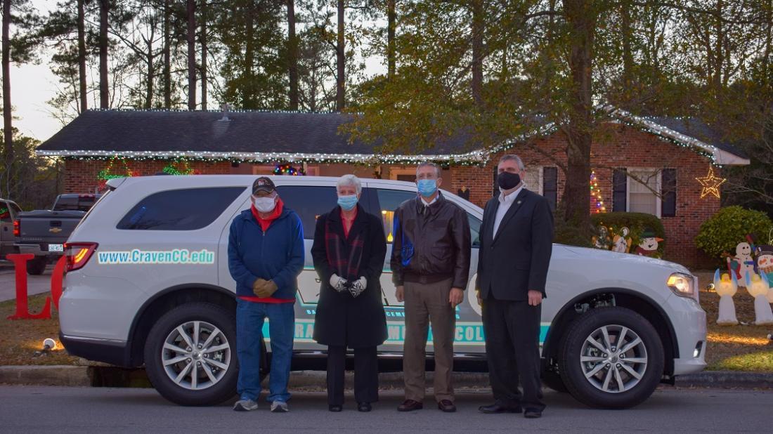 The Craven Community College Foundation will benefit from donations given during the Crousore family’s Christmas light show, located at 2917 Roanoke Avenue. Pictured left to right are Chris Crousore, Anna Crousore, Craven CC President Dr. Ray Staats and Executive Director of Institutional Advancement Charles Wethington.