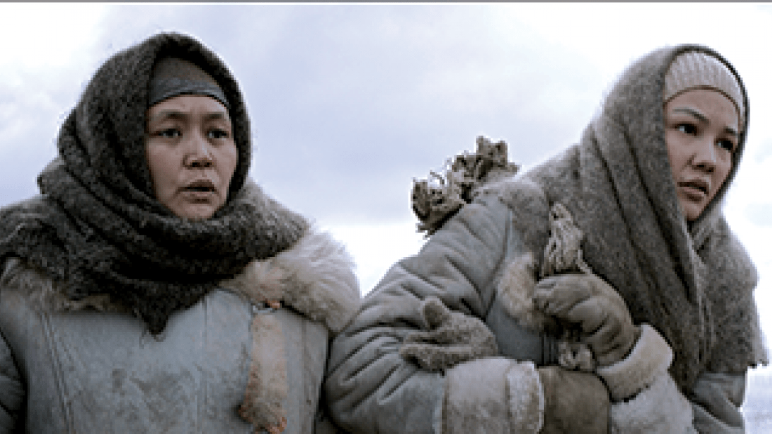 The Road to Mother film photo of two women bundled up outside