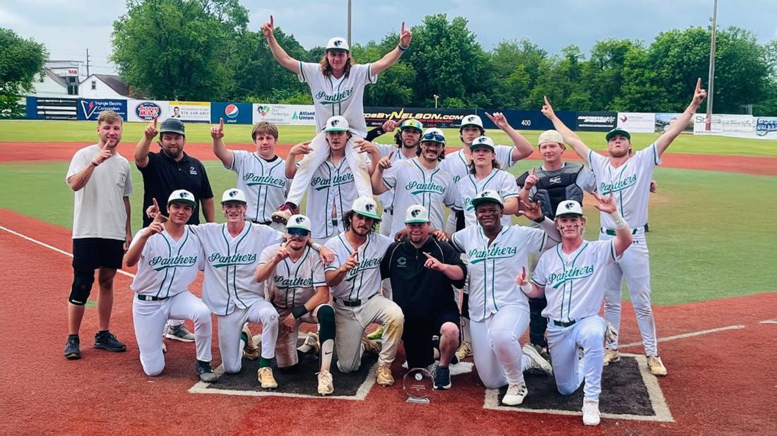 Panthers baseball players in a group with trophy