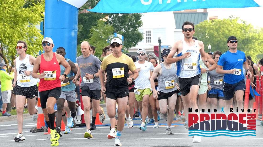 Group of runners at the Neuse River Bridge Run NRBR 2025 starting line