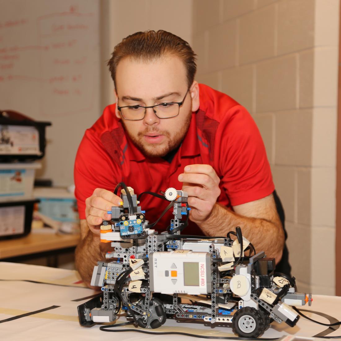 NC State Engineering program student tinkering with project