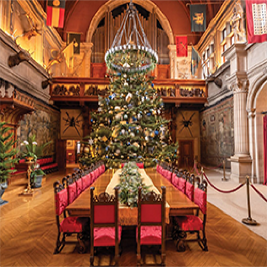 Interior view of banquet table and seating with Christmas décor inside the Biltmore Estate.