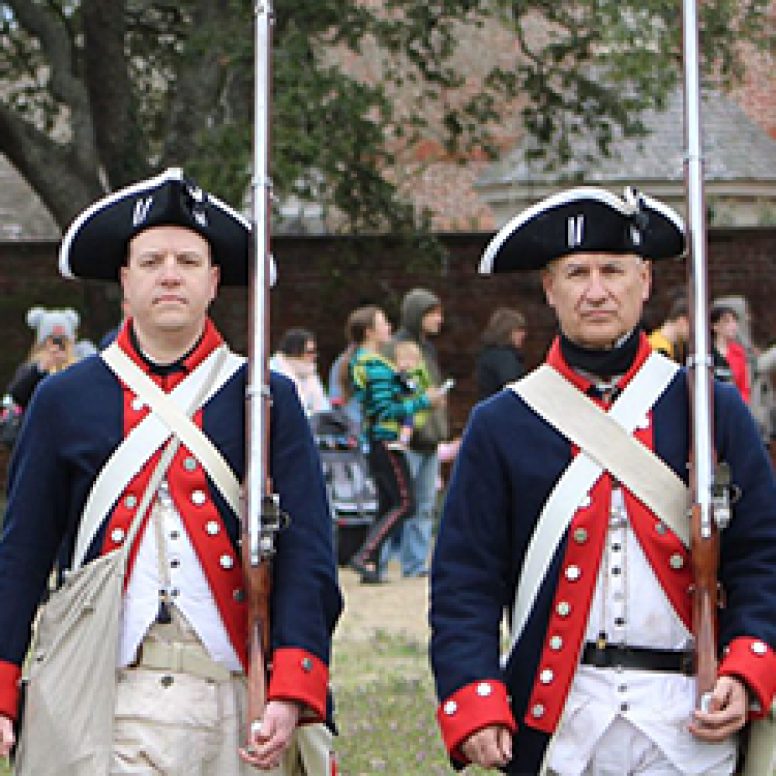 Two male actors dressed as American Revolution soldiers