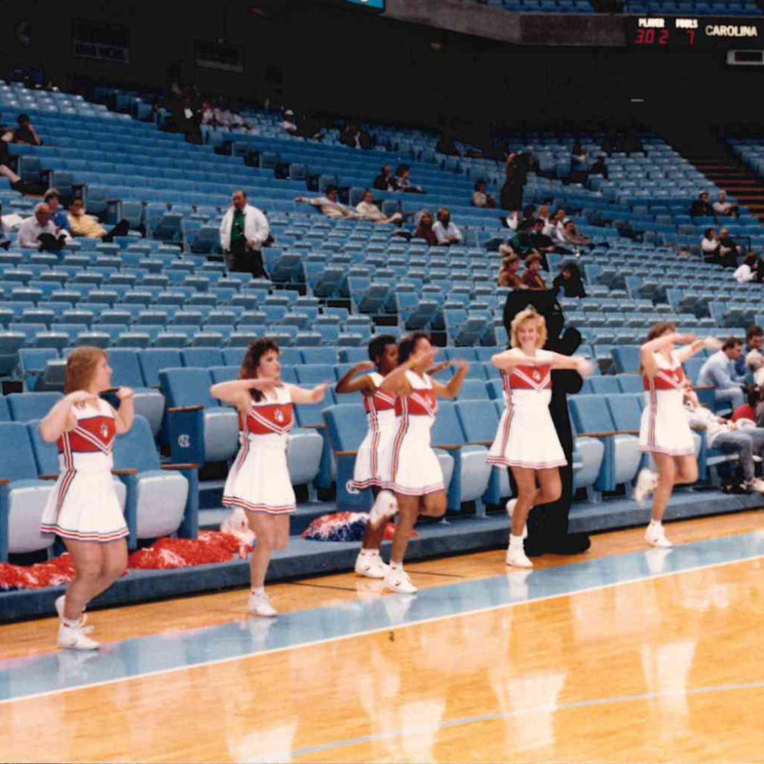 Cheerleaders cheering at basketball game in 1989