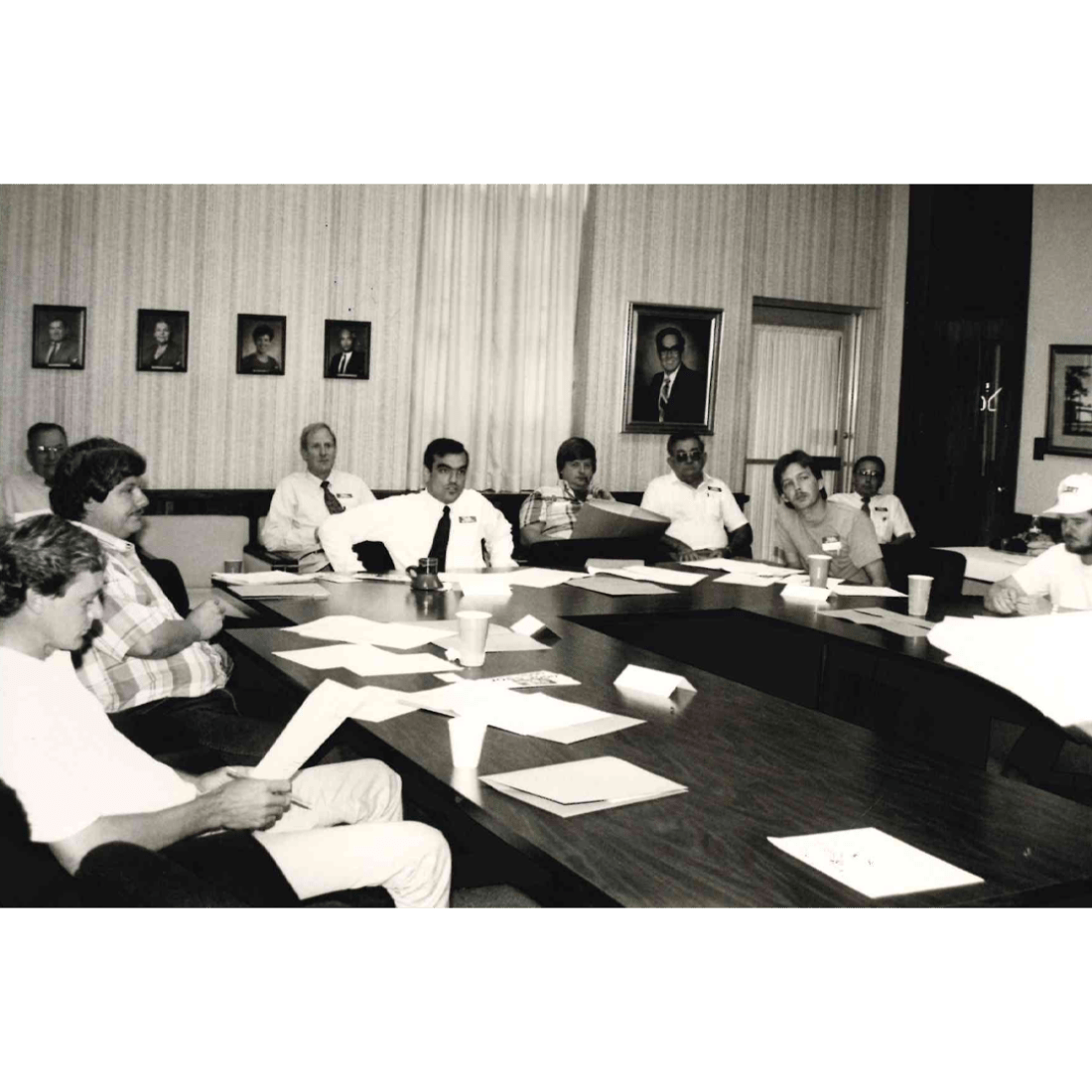 People meeting in board room in 1992