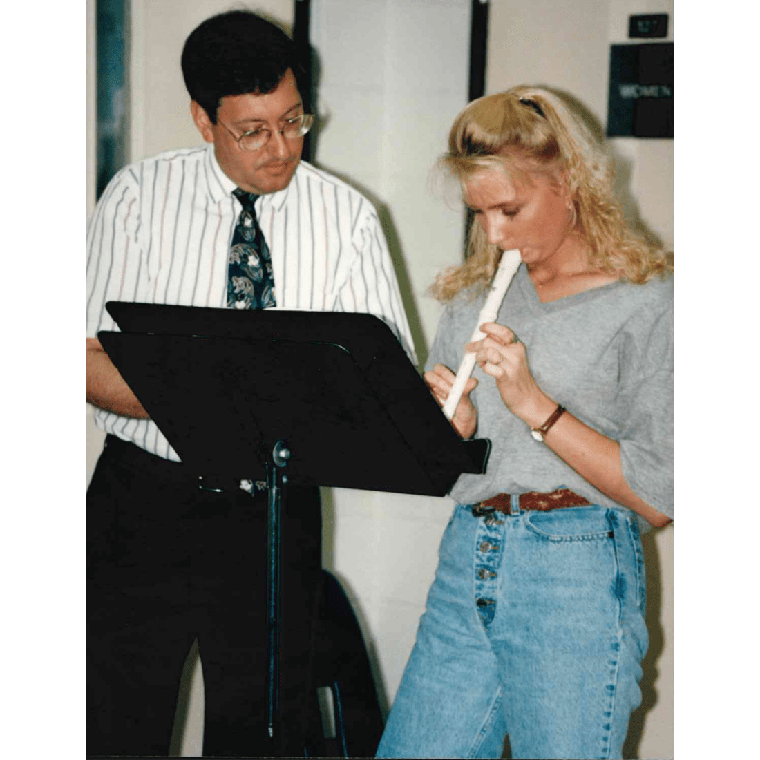 Phil Evancho gives a recorder lesson to female student in 1997
