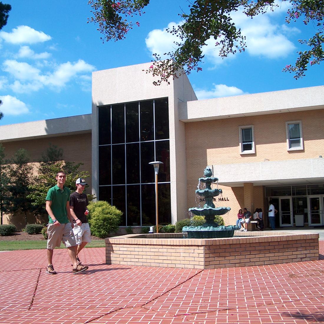 Students walking by fountain in front of Barker Hall in 2000s