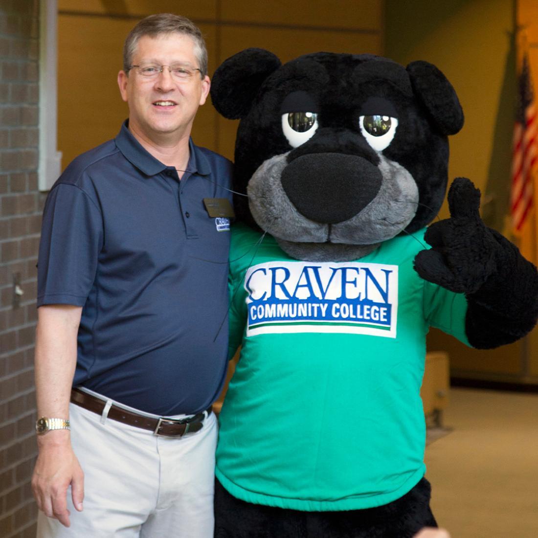 Craven CC President Dr. Ray Staats and mascot Knight the Panther