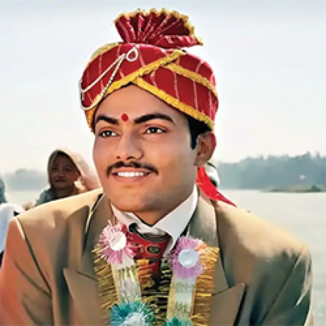 Hindi groom in red and gold turban