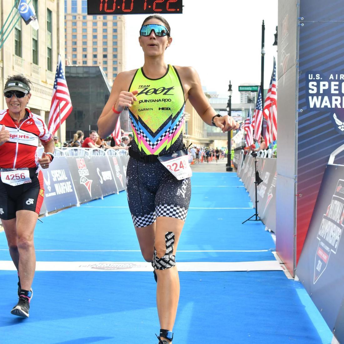 runner crosses finish line