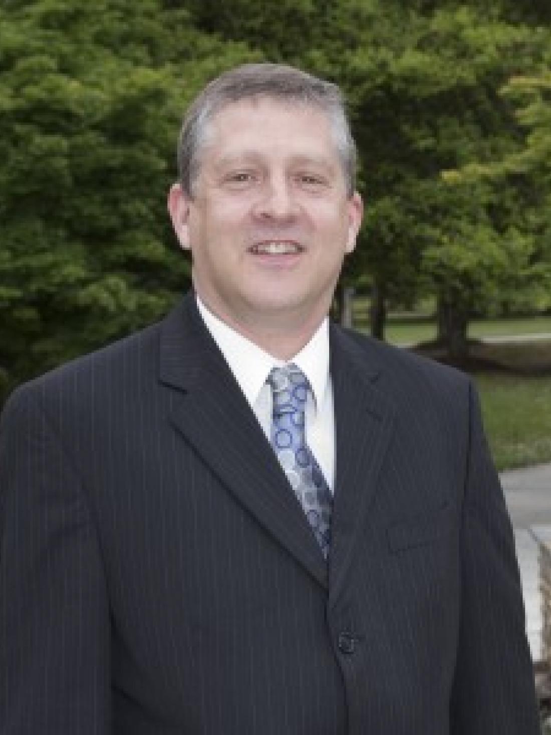 College President Dr. Ray Staats standing outside