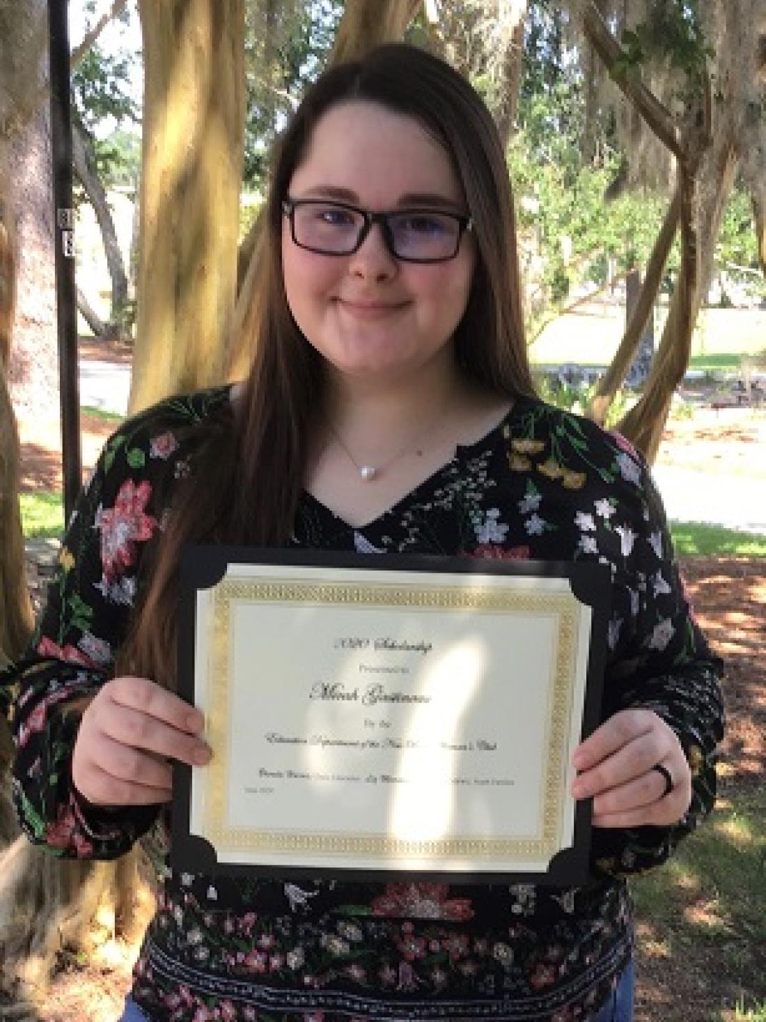 Student Micah Gastineau with certificate