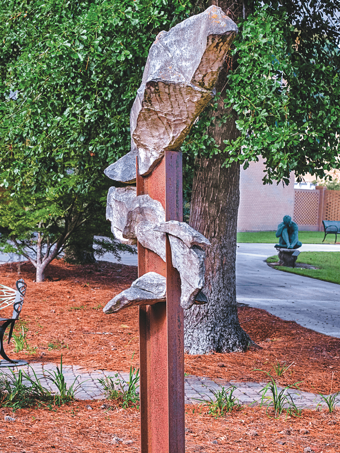 Welded steel, fiber glass, and steel reinforced concrete statue