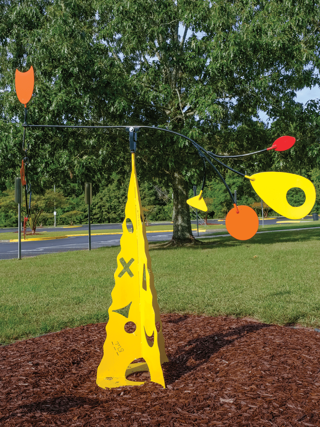 Yellow, orange, and red painted iron sculpture