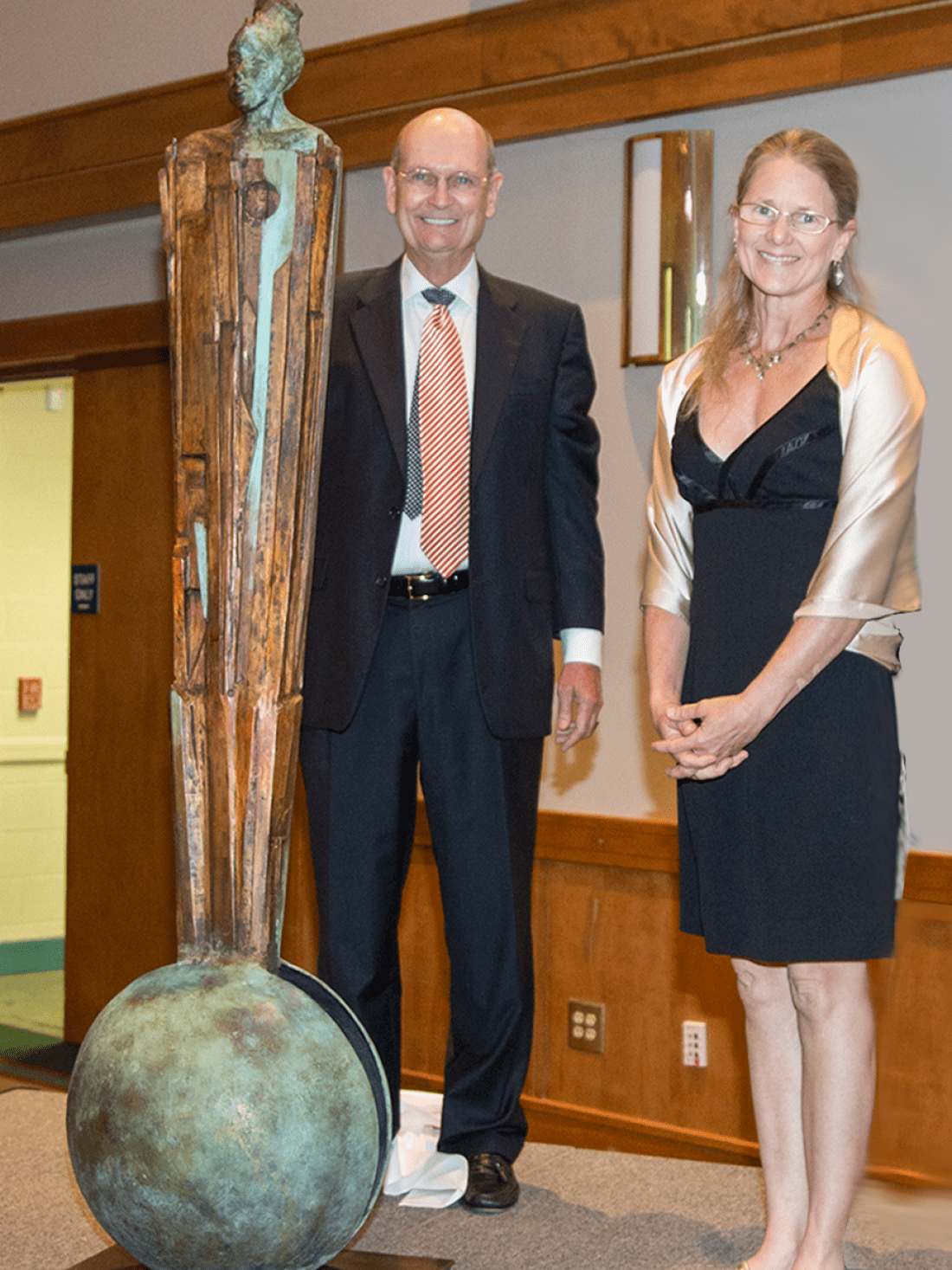 Dr. Jim Congleton and artist Chris Richards stand next to her sculpture titled "Break into Subconsciousness"