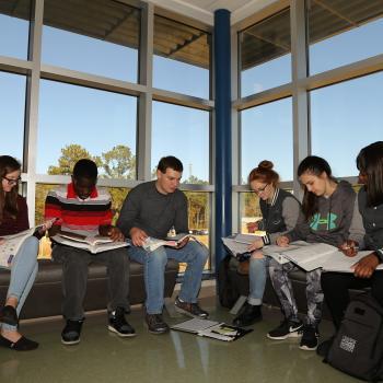 group of students sitting and studying