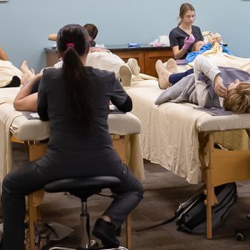 Students in the Esthetics Technology program give patients facials