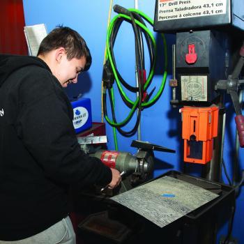 Student in the Advanced Manufacturing Tools for Veterans program on the Havelock campus works on equipment