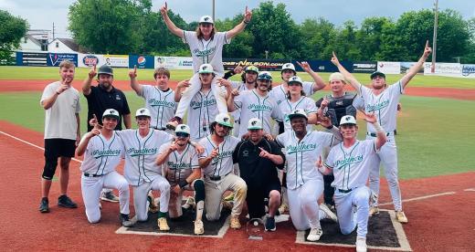 Panthers baseball players in a group with trophy
