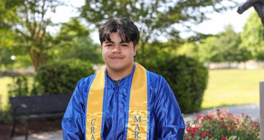 Person standing in graduation robe