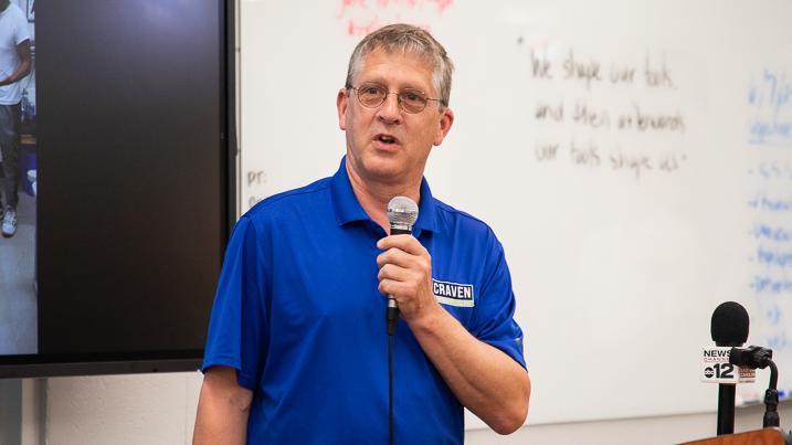 Craven CC president Dr. Ray Staats speaks at the College's barbershop grand opening