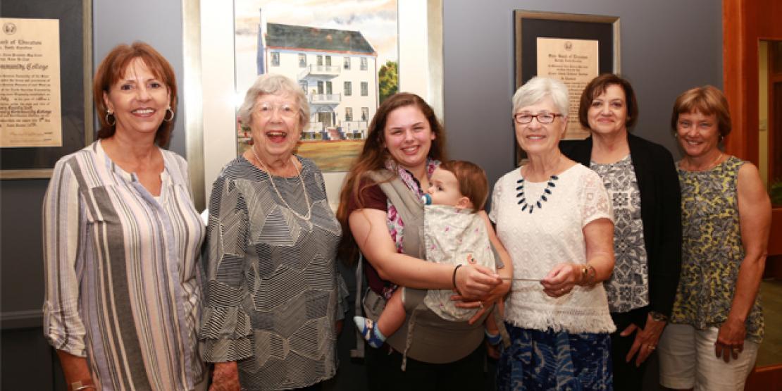 Pictured are, left to right, Craven CC Financial Advisor Carolyn Ward, Mary Peterson, Casey and her baby Sullivan, Ann Corby, Theresa Harrigan and Janine Sellers.
