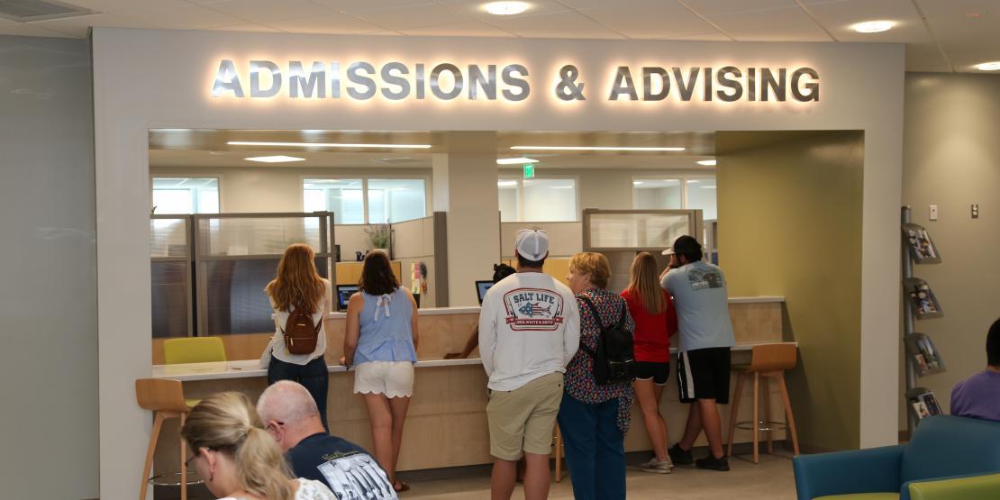 Students registering for classes in Admissions & Advising department