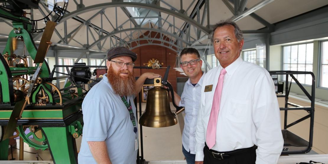 Tryon Palace Network & Exhibits System Administrator Rob Jones (left), recruited the help of Craven CC instructor Jeff Brown (center) and Dean of Career Programs Ricky Meadows (right) to replace a broken piece of a 1911 mechanical clock, located in the North Carolina History Center.
