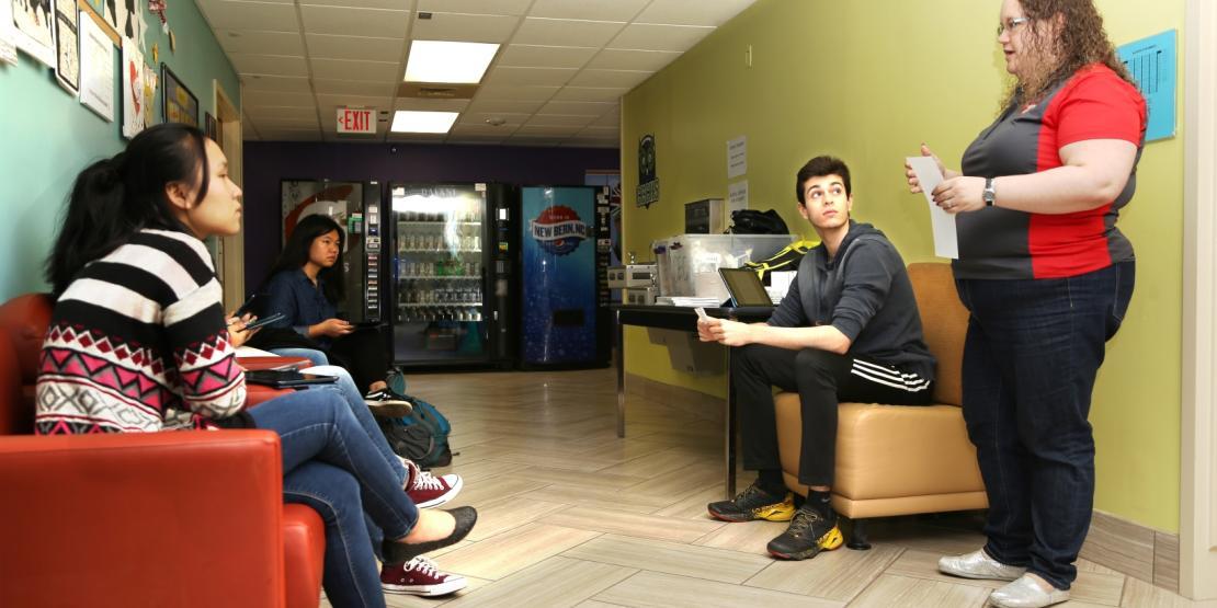 Alison Strommer, far right, instructs Craven Early College students during a literature class.