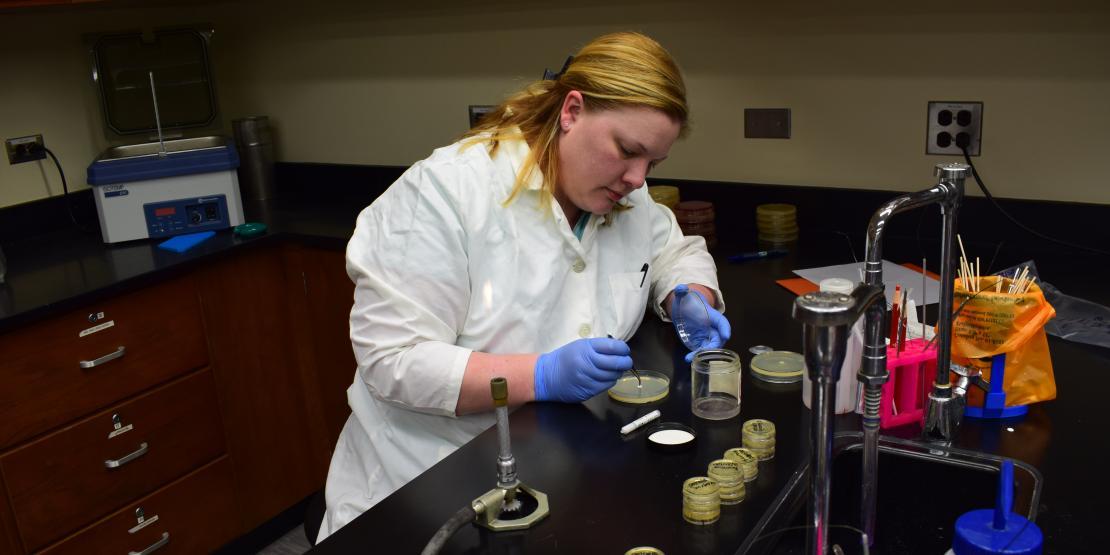 Science teacher Jessica Cofield conducts experiment