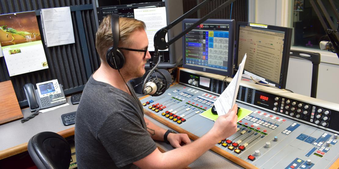 Public Radio East host reads script 