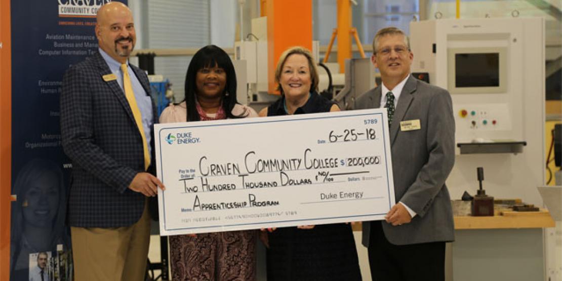 Duke Energy presented a $200,000 grant to Craven Community College Monday to create the Craven County Apprentice Program (CCAP), which connects students with hands-on training and career development opportunities. Pictured are, left to right: Mike Hughes, Duke Energy vice president of community relations, Tammy Thurman, Piedmont Natural Gas district manager, Millie Chalk, Duke Energy district manager and Dr. Ray Staats, Craven CC president.
