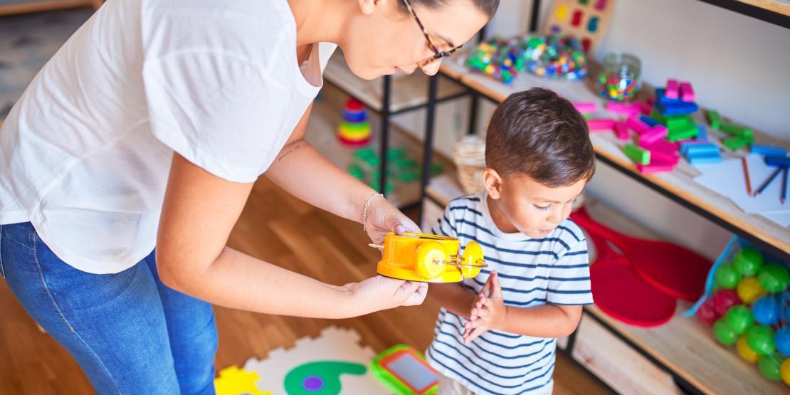 woman working with young boy