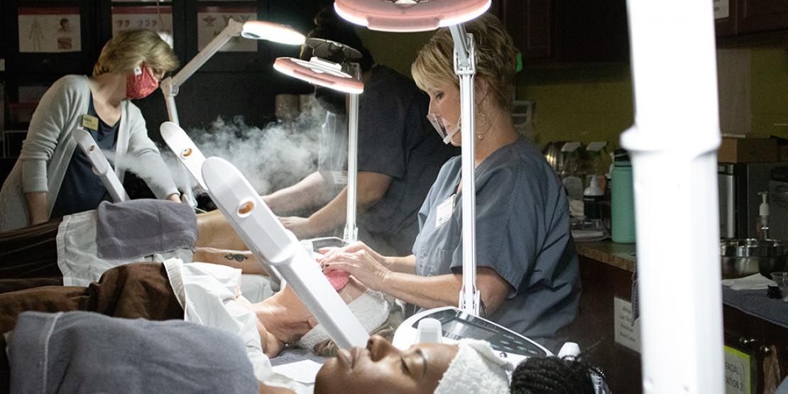 esthetician students performing facials