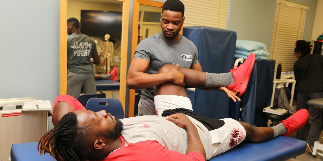 Physical Therapist Assistance program students practicing PT maneuvers