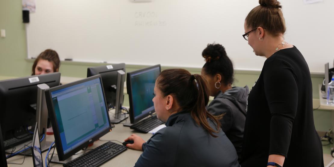 Health Information Technology students on computers