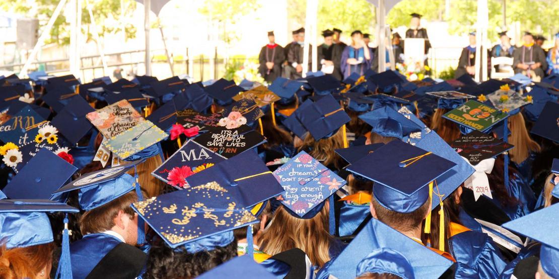 top of graduate caps decorated at graduation