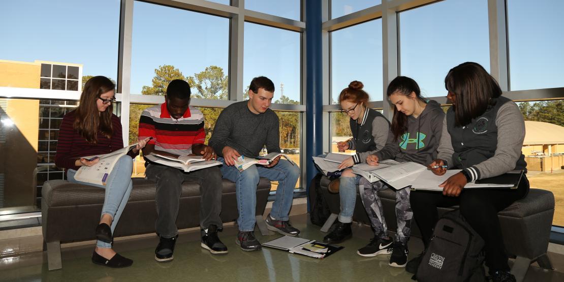 group of students sitting and studying