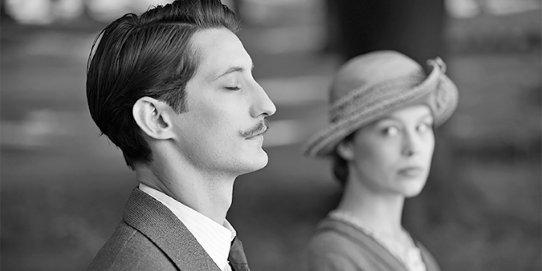 Franz movie photo with woman looking at man who is closing his eyes