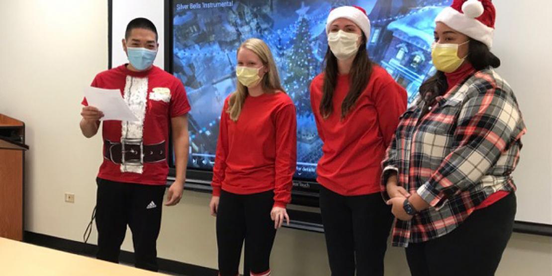 Chemistry students performing Chemistry Carol in front of classroom