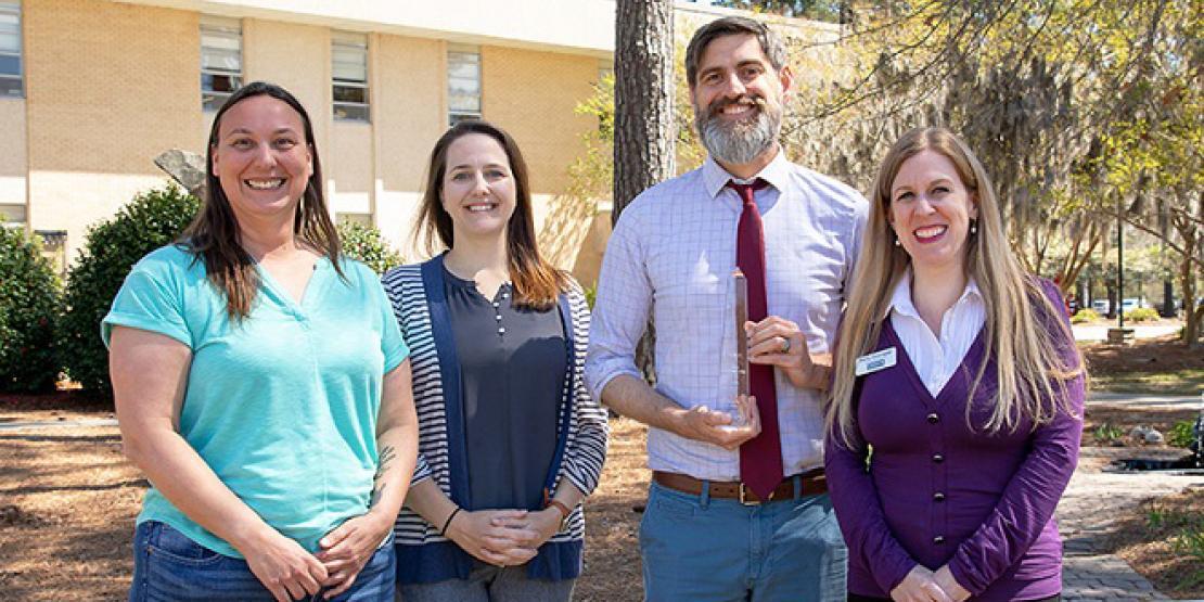 Craven Community College recently won a gold Paragon Award for its redesigned website from the National Council for Marketing & Public Relations. Pictured left to right are: Office 365 Systems Administrator Christina Sobrido, Marketing Specialist Meredith Laskovics, Director of Communications Craig Ramey, and Communications Specialist Holly Desrosier.