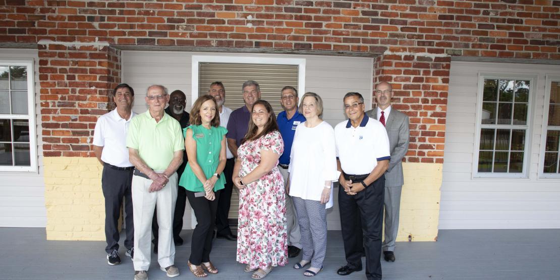 Group photo in front of Volt Kitchen exterior