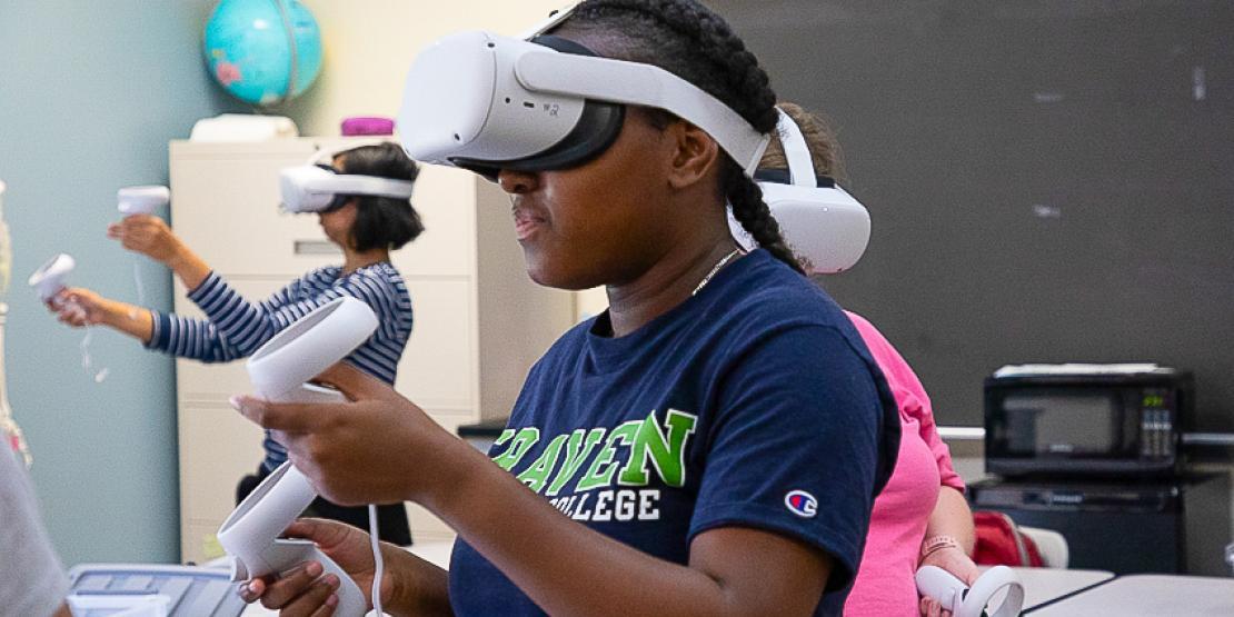 A Transitions Academy student explores space in a virtual reality headset.