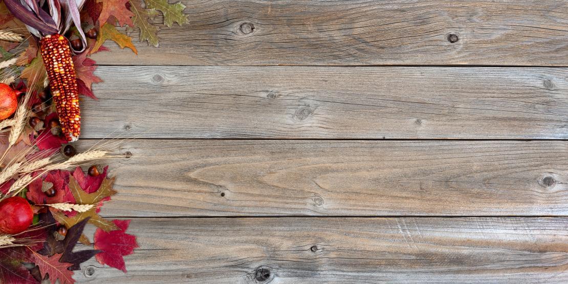 Festive fall decorations on wooden planks