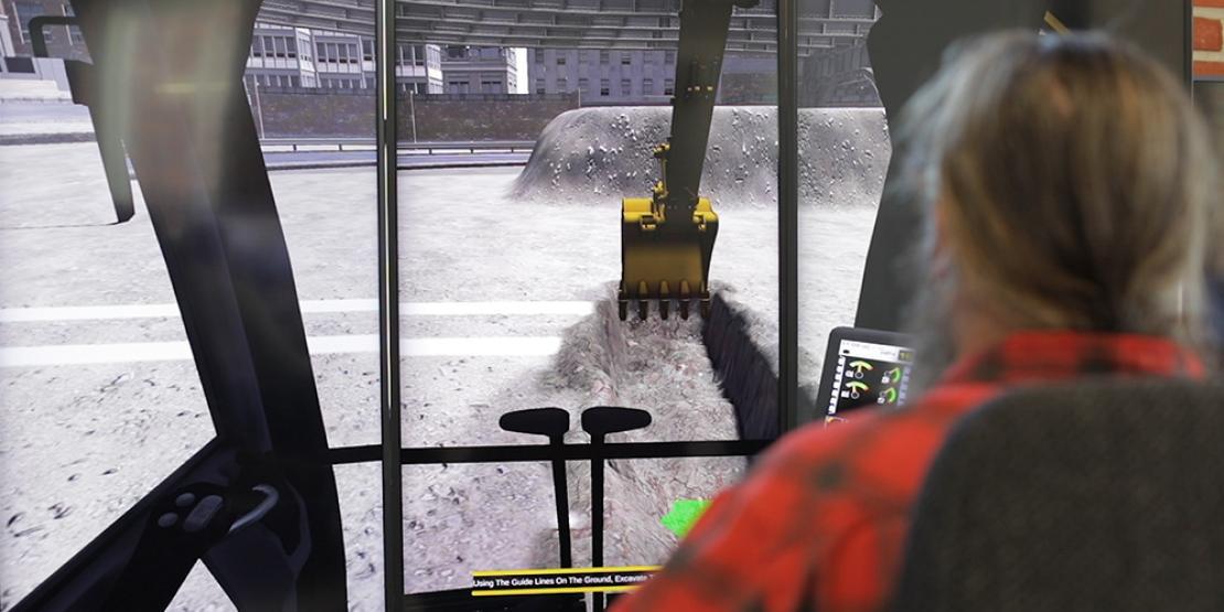 Man uses excavator simulator