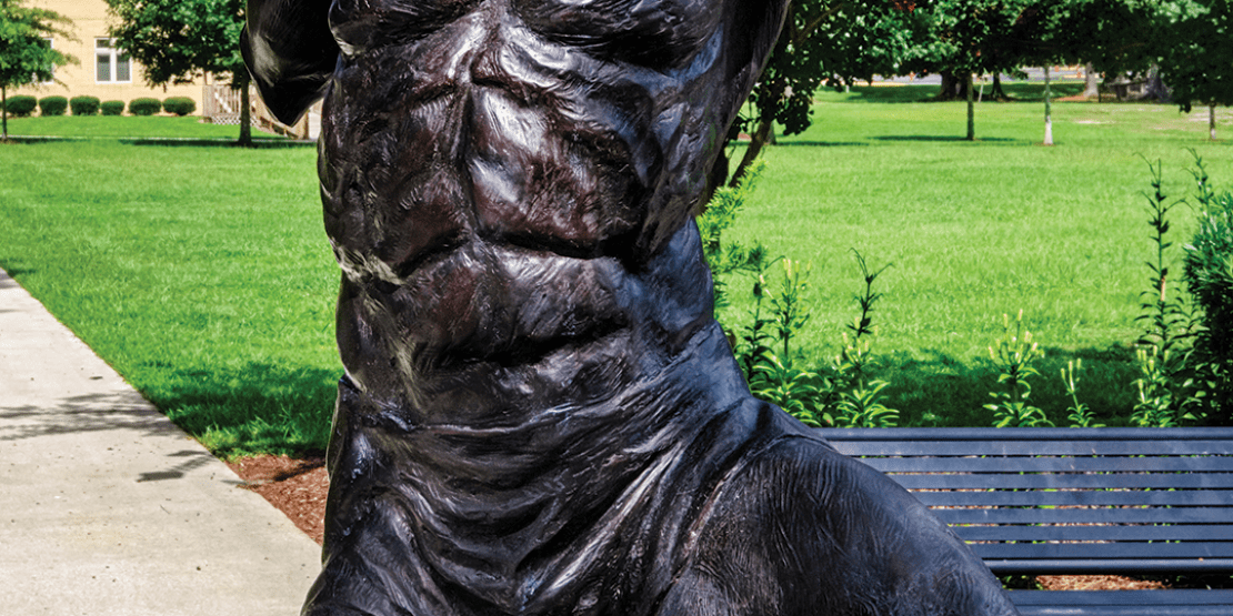 Bronze statue of male head and torso