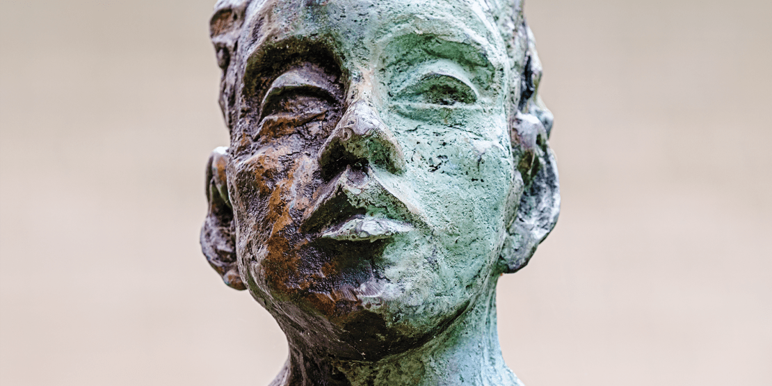 Painted aluminum statue of woman
